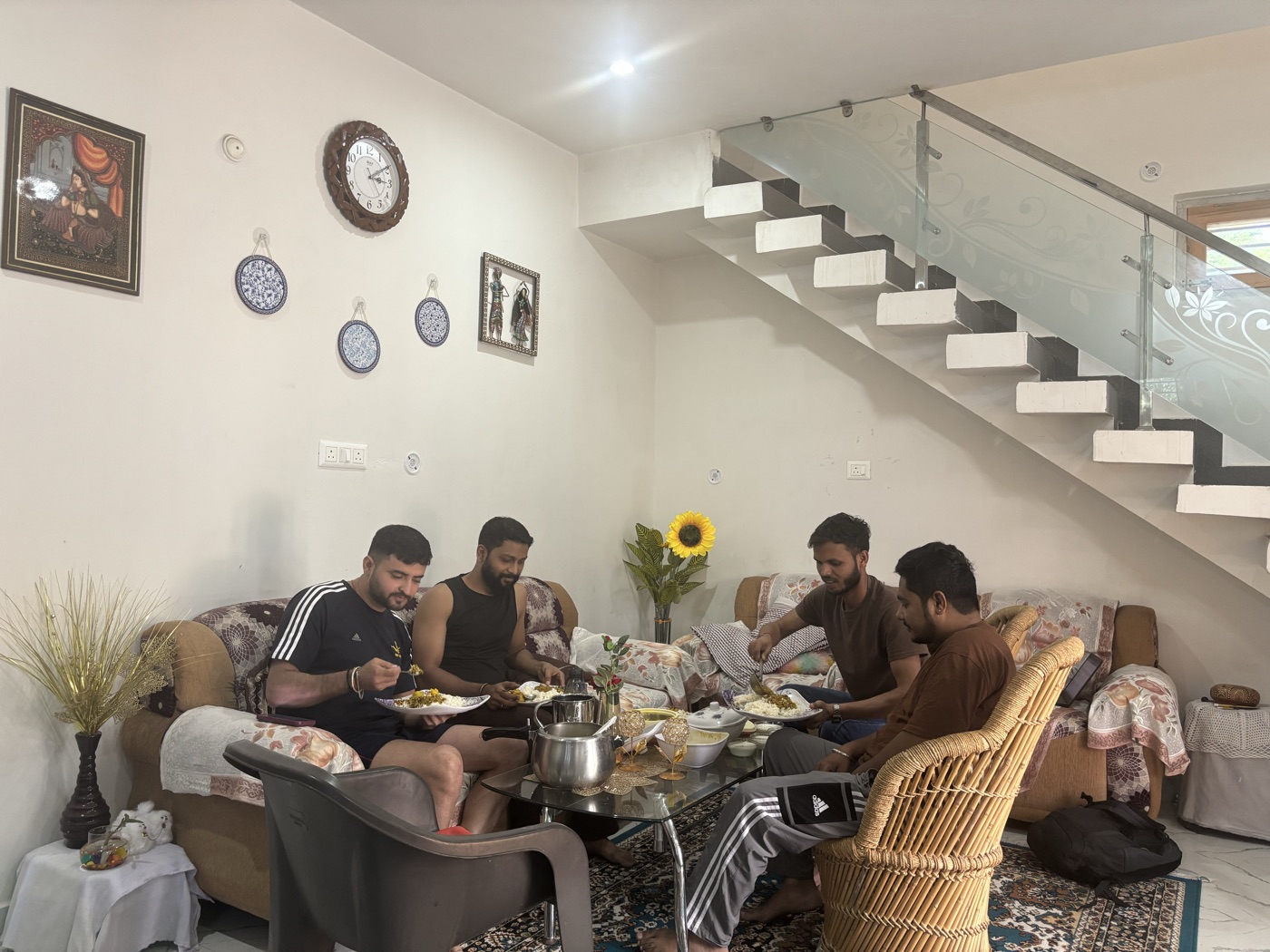 Guests sharing a meal in the dera living room