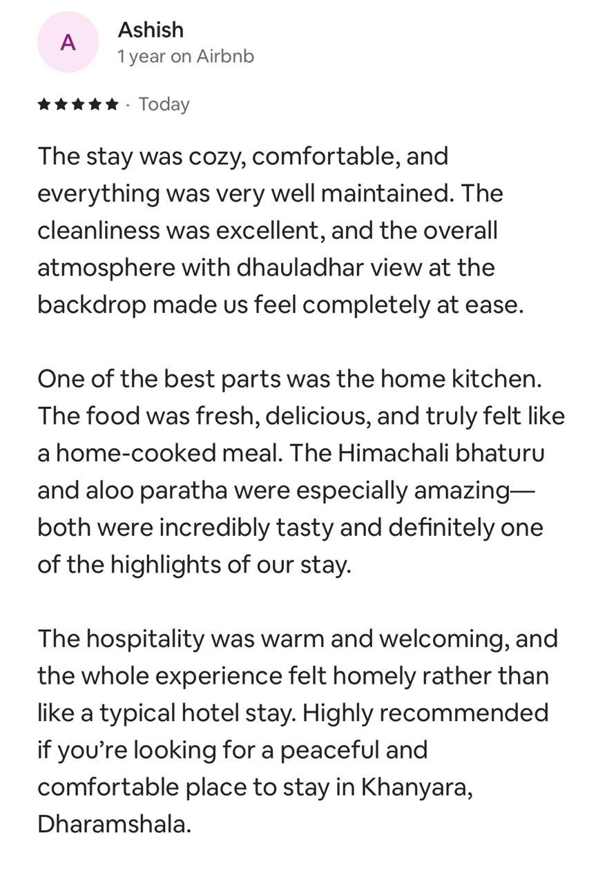 Five-star Airbnb review by Ashish: cozy, comfortable and very well maintained with a Dhauladhar view; the home kitchen was one of the best parts, the Himachali bhaturu and aloo paratha were amazing; hospitality was warm and the stay felt homely rather than like a hotel.